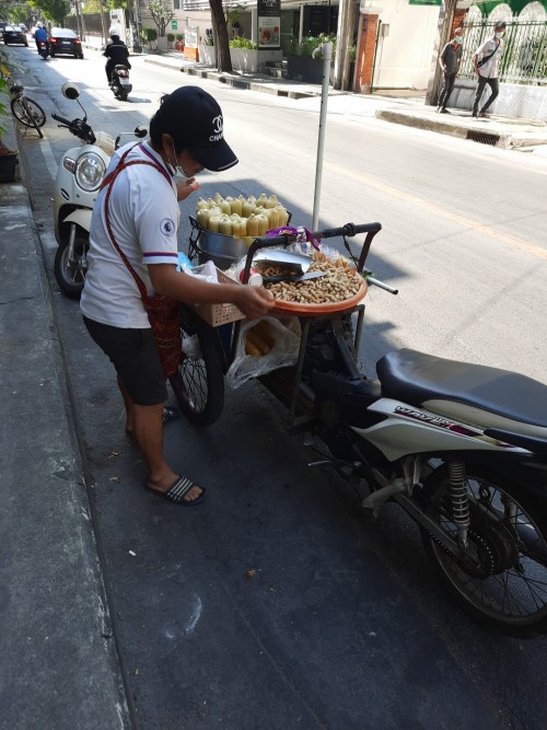 A peanut and corn-on-the-cob seller