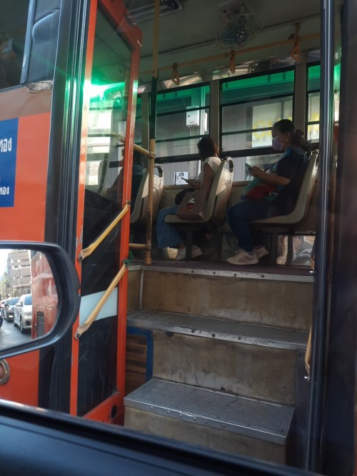 Commuters and their mobiles. Rama IV, Bangkok