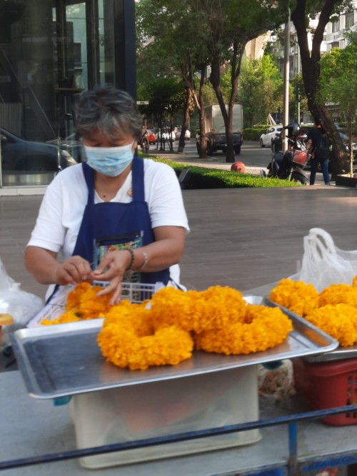 A street-side garland maker