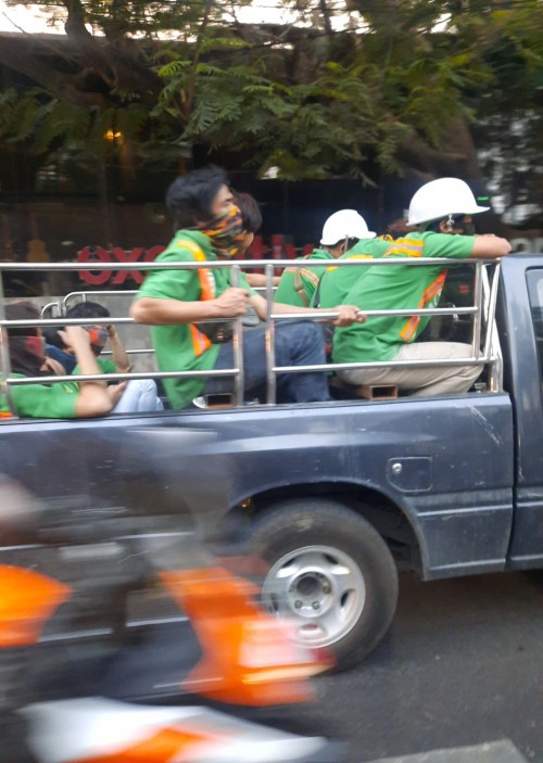 A construction crew on the way home in the evening