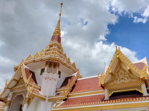 A temple's roof against the blue sky, Wat That Thong